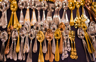 Vintage spoons on a flea market. Selective focus.