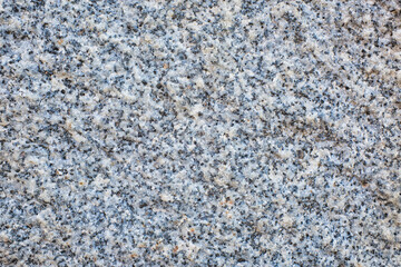 Rough granite surface forming textured background in pyrenees mountains.