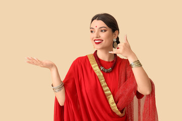 Beautiful young Indian woman showing 