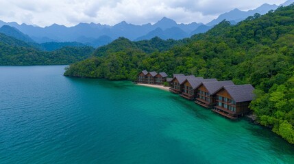 Naklejka premium Serene Eco Resort Surrounded by Lush Mountains and Tranquil Waters in Nature