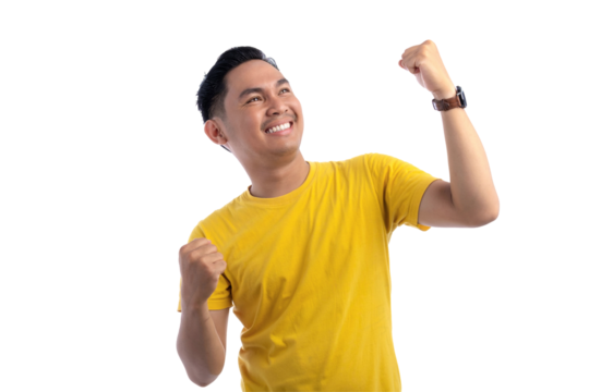 Portrait of excited handsome Asian man raising hands, celebrating good luck, gesturing victory isolated on transparent background