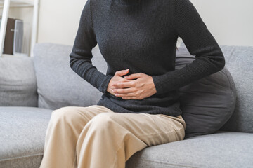 pregnant woman sitting on sofa