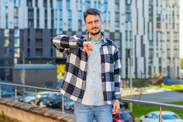 Dislike. Upset Caucasian mature man showing thumb down sign gesture, expressing discontent...