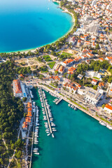 Obraz premium Aerial view of Makarska town, marina with boats and yachts. Dalmatia region, Croatia