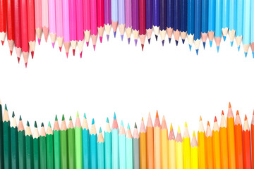 Frame made of pencils on white background