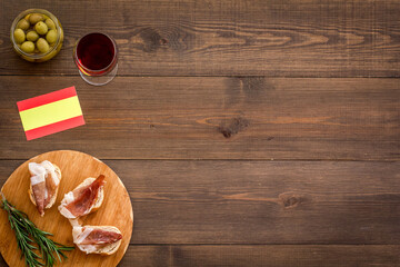 Antipasti - prosciutto ham and glass of wine. Traditional Spanish meal