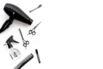 Barbershop tools set on white background - combs and scissors, top view