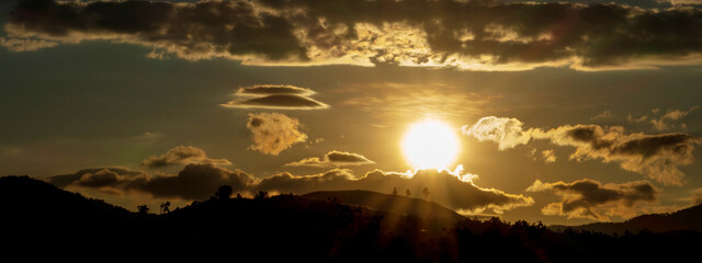 Fototapeta premium Banner Golden sky sunrise dramatic beautiful landscape view. Dawn sky gold dusk time cloudscape with sunlight. Panorama Dramatic sunset scenic landscape. Beautiful landscape nature with copy space