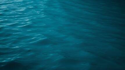 Water Surface: Deep Teal Waves Reflecting Light in Tranquil Harmony