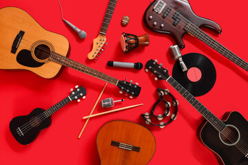 Different musical instruments on red background