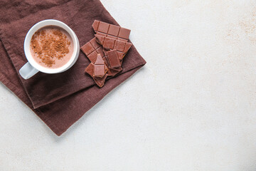 Cup of sweet chocolate milk on white background