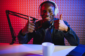 African american video blogger records content in his studio.
