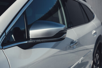A modern subcompact crossover SUV in white with beautiful wheels and a large chrome grille.
