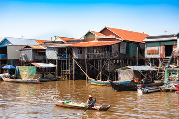 Floating village in Cambodia with traditional wooden houses