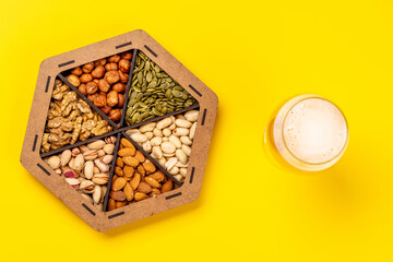 A vibrant assortment of various nuts and beer