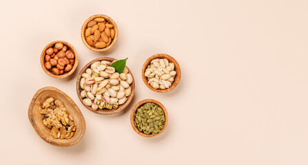 A vibrant assortment of various nuts, including almonds, walnuts, hazelnuts, cashews, and pistachios