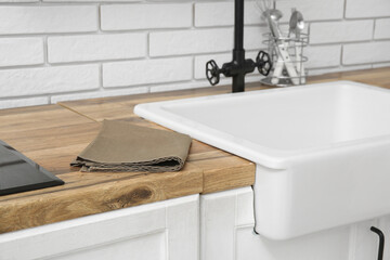 Brown napkin on counter in modern kitchen. Closeup