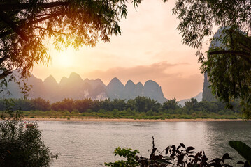 Li river landscape in rural China on sunset with karst hills