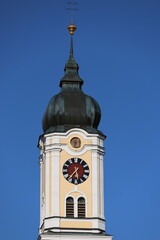 Clock tower in front of blue sky