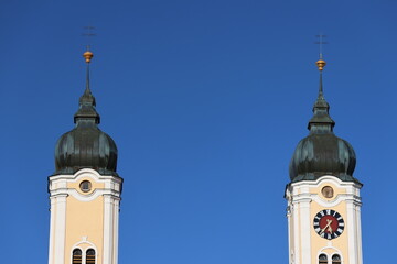 Clock tower in front of blue sky
