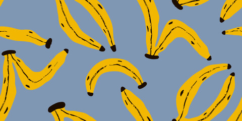 Yellow bananas on a blue background.Seamless pattern. Hand drawn style. 