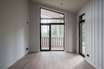 Obraz premium Stylish and Contemporary Modern Interior Featuring Large Windows with Abundant Natural Light