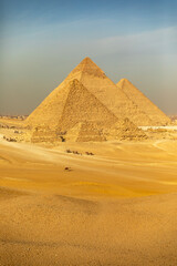 Feature a world wonder panorama of the Giza Pyramids, Egypt's ancient pharaonic site. Ideal for...