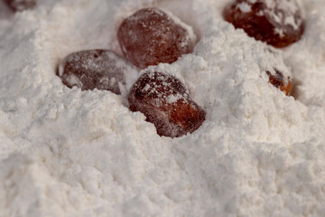dehydrated candied fruits of kumquat in white powdered, closeup