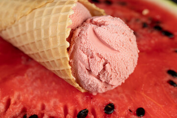 ice cream and watermelon, a waffle cup with watermelon-flavored ice cream and red fresh watermelon, close up