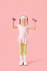 Sporty little girl with dumbbells on pink background