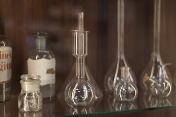 chemistry, medical, science background,  glass transparent flasks, retorts, test tubes and more in old pharmacy