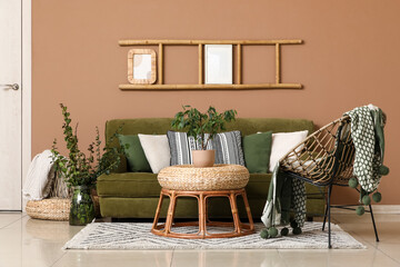 Interior of living room with green sofa, armchair and ladder