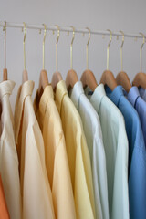 Colorful Cotton Shirts on Hangers Organized in Soft Pastel Tones