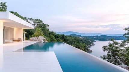 Fototapeta premium Modern, minimalist home with infinity pool overlooking serene ocean view. Lush greenery surrounds the home, nestled on a hillside