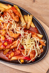 French fries with spicy chicken fajitas