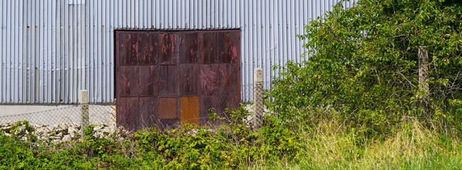 Close-up view of an old industrial building. Abstract background for various uses.
