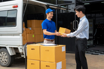 Asian delivery man delivers parcel to a customer at home office, fast shipping, e-commerce, and...