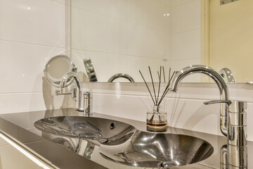 A stylish modern bathroom featuring sleek fixtures, a minimalistic design, and a sophisticated color palette, creating a serene and functional space.