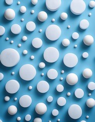 淡いブルーの背景に広がる大小さまざまな白い水玉、それぞれが少し光沢を帯びてシンプルながら動きのあるデザインを作り出している