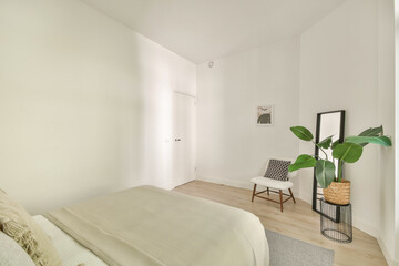 A serene and stylish bedroom featuring neutral tones, minimalist decor, indoor plants, and natural light, promoting tranquility and relaxation.
