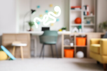 Blurred view of teenager's room with workplace, neon lamp and shelf unit