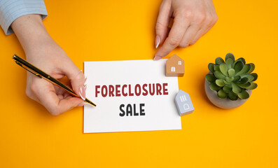 Foreclosure sale concept. Sale of a property that was seized by a lender or government because the...