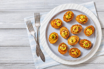 Deep fried deviled eggs with coating of panko