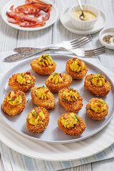 Deep fried deviled eggs with coating of panko