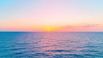 Fototapeta premium serene ocean horizon with sun setting, casting beautiful colors across sky