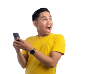Surprised young Asian man using smartphone and looking aside at copy space isolated on transparent background