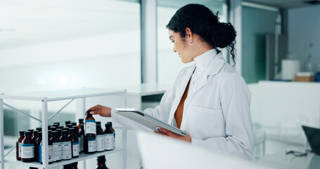 Bottle, scientist and woman on tablet in lab for research, medical innovation and discovery....