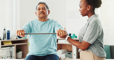 Obraz premium Resistance band, physical therapy and senior man in clinic for consultation with muscle recovery. Injury, healthcare and woman physiotherapist helping mature male patient with stretch arm exercise