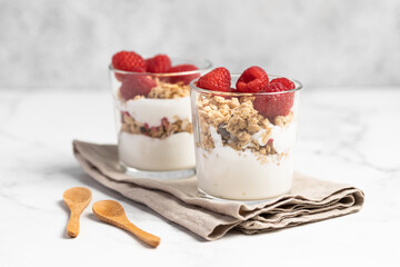 yogurt with granola and raspberries, breakfast