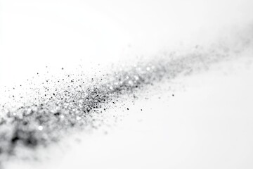Fototapeta premium Abstract silver glitter scattered on white background, creating a sparkling, elegant design.